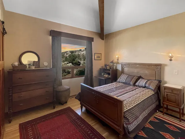 a bedroom with a bed and window