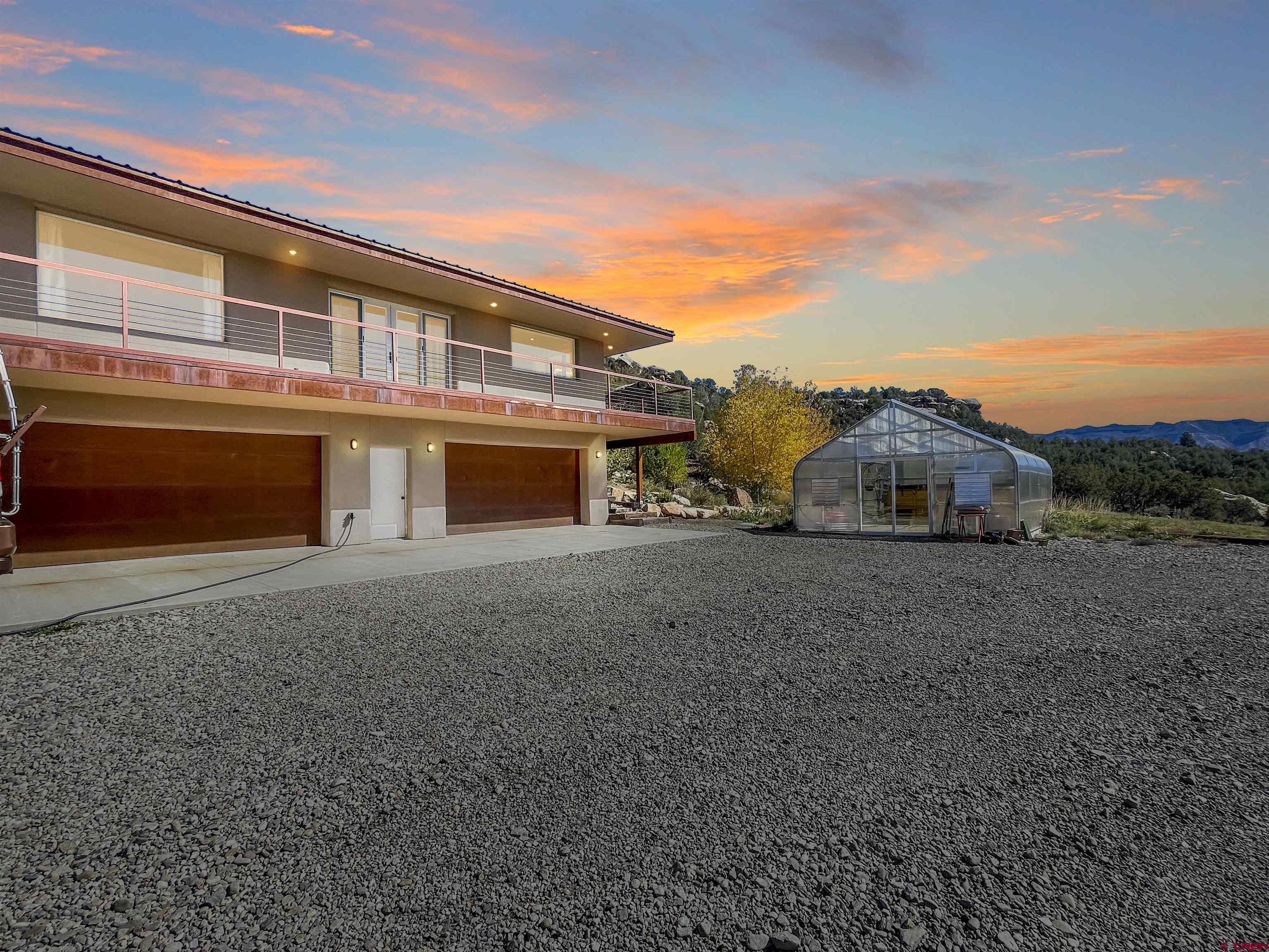 20615 Rd G Cortez, CO 81321 - Photo 8 of 43 a front view of a house with a yard