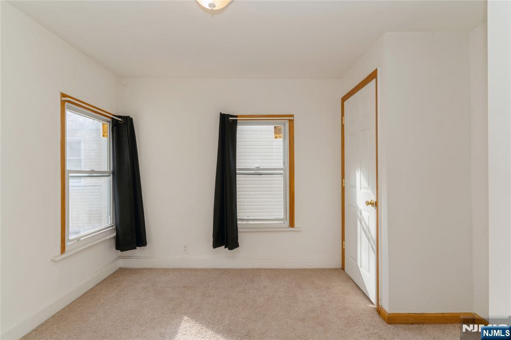 656 Scotland Road Orange, NJ 07050 - Photo 12 of 23 an empty room with windows