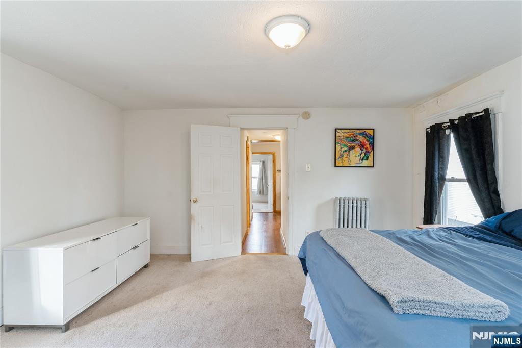 656 Scotland Road Orange, NJ 07050 - Photo 14 of 23 a bedroom with a bed and a window