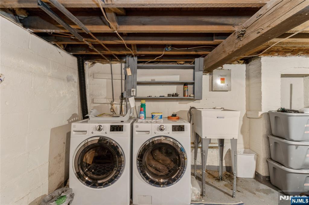 656 Scotland Road Orange, NJ 07050 - Photo 17 of 23 a view of a storage & utility room with washer and dryer