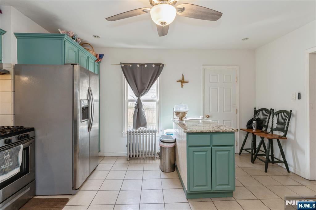 656 Scotland Road Orange, NJ 07050 - Photo 4 of 23 a room with cabinets and stainless steel appliances