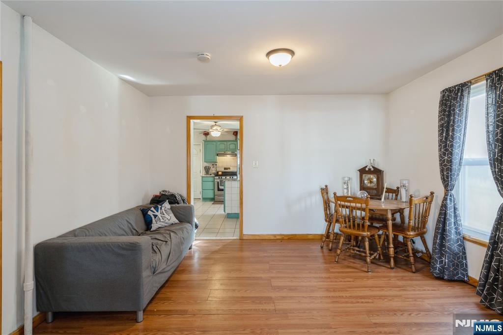 656 Scotland Road Orange, NJ 07050 - Photo 6 of 23 a living room with furniture and a wooden floor