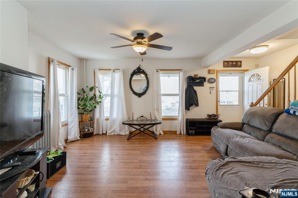656 Scotland Road Orange, NJ 07050 - Photo 7 of 23 a living room with furniture and a flat screen tv