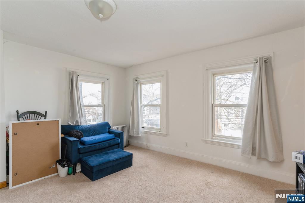 656 Scotland Road Orange, NJ 07050 - Photo 10 of 23 a living room with furniture and a window