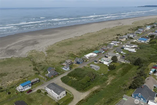 an aerial view of house with yard