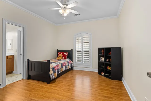 a bedroom with a bed and a book shelf