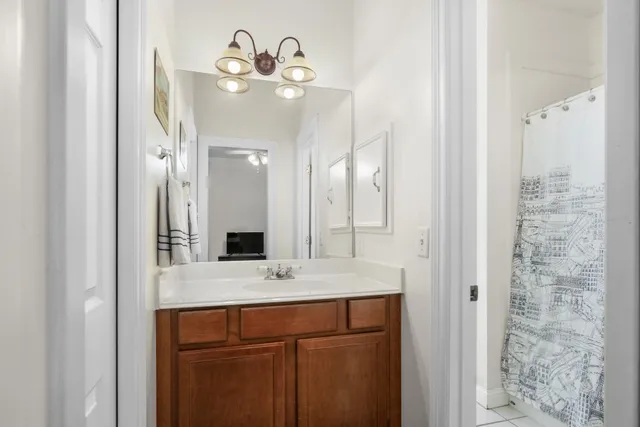 a bathroom with a double vanity sink and a mirror
