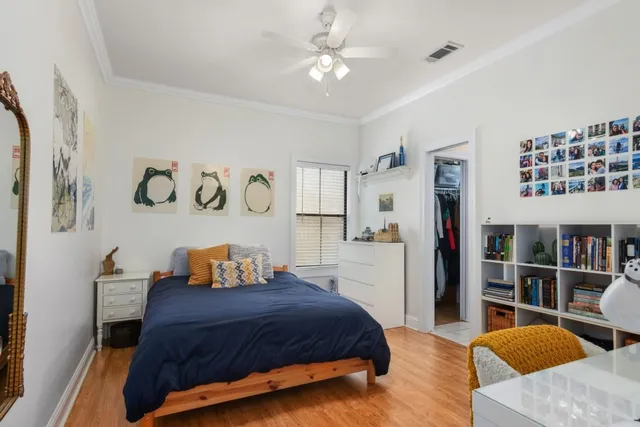 a bedroom with a bed and a book shelf
