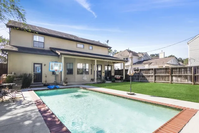 a view of a house with sitting area and garden