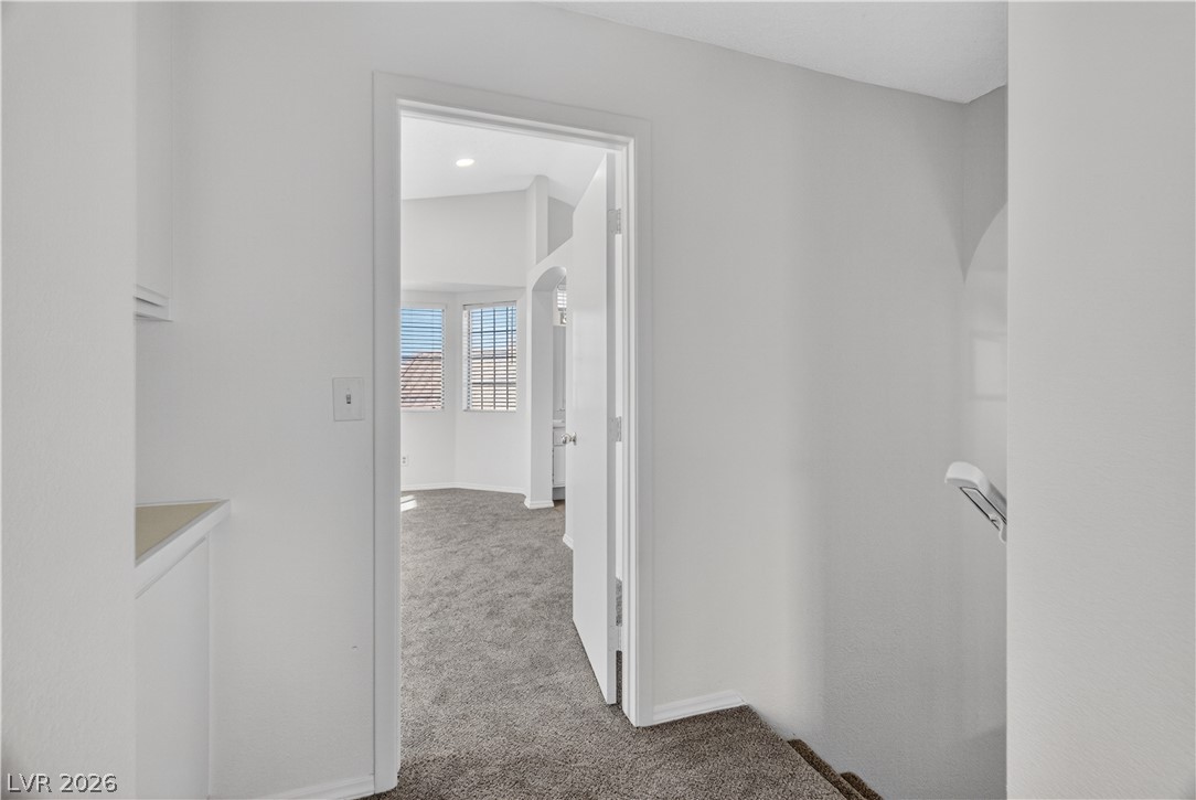 3156 Terrace View Drive Laughlin, NV 89029 - Photo 27 of 94 A quiet landing offers access to a naturally illuminated room with vaulted ceilings and ample window light.