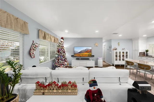 an aerial view of a house with a garden and mountains