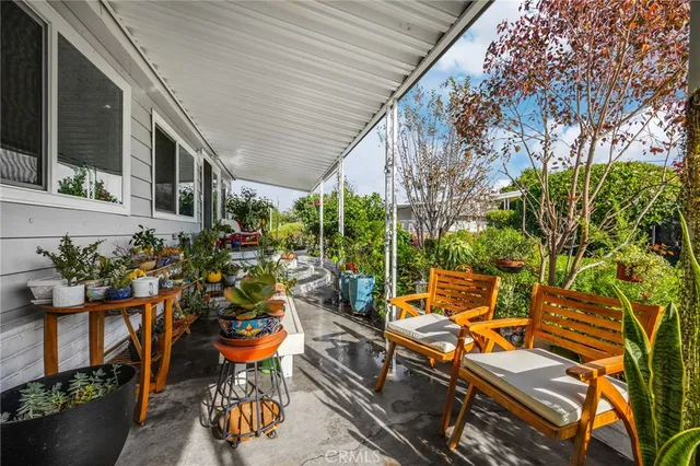 a view of an outdoor sitting area with furniture