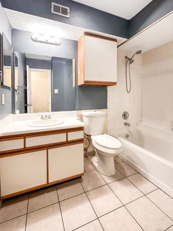 a bathroom with a sink a toilet and a bathtub