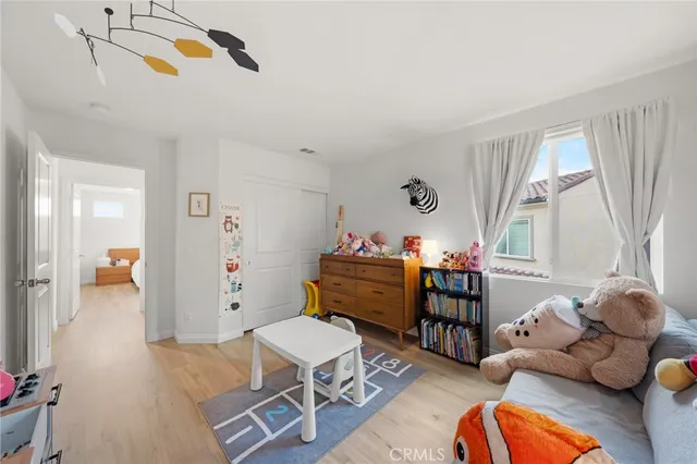 a bedroom with furniture and a window