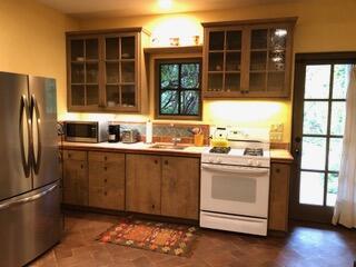 0 East Valley Road Montecito, CA 93108 - Photo 5 of 10 a kitchen with stainless steel appliances granite countertop a refrigerator and a window
