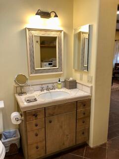 0 East Valley Road Montecito, CA 93108 - Photo 8 of 10 a bathroom with a granite countertop sink and a mirror