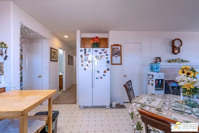 a view of a dining room with furniture and a table