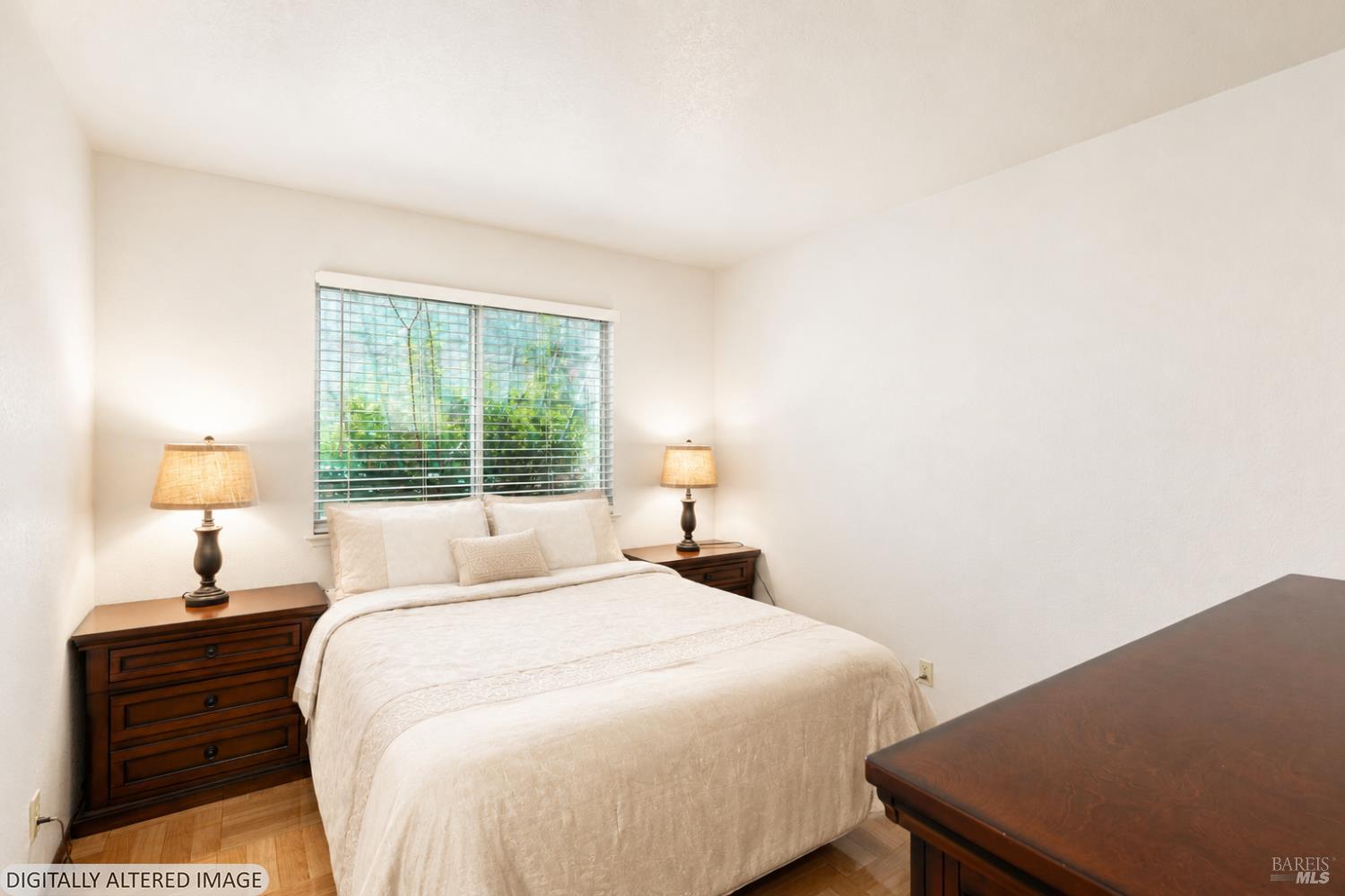 1935 Seville Street Santa Rosa, CA 95403 - Photo 17 of 30 a bedroom with a bed and a lamp