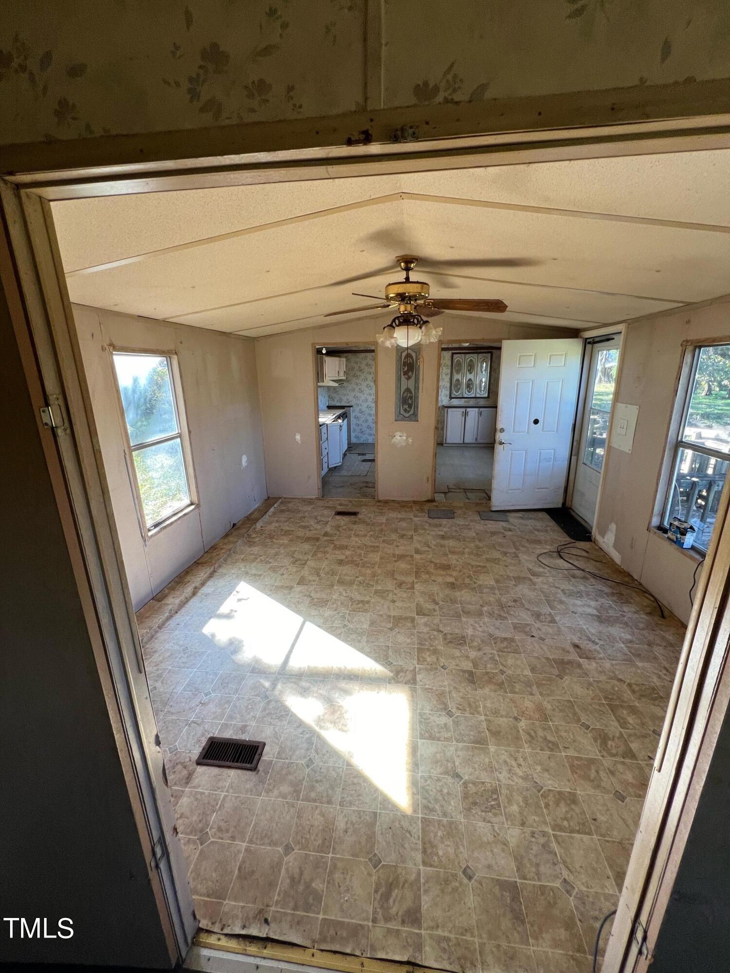 377 Mellie Clayton Road Roxboro, NC 27574 - Photo 9 of 14 a view of a hallway with a window