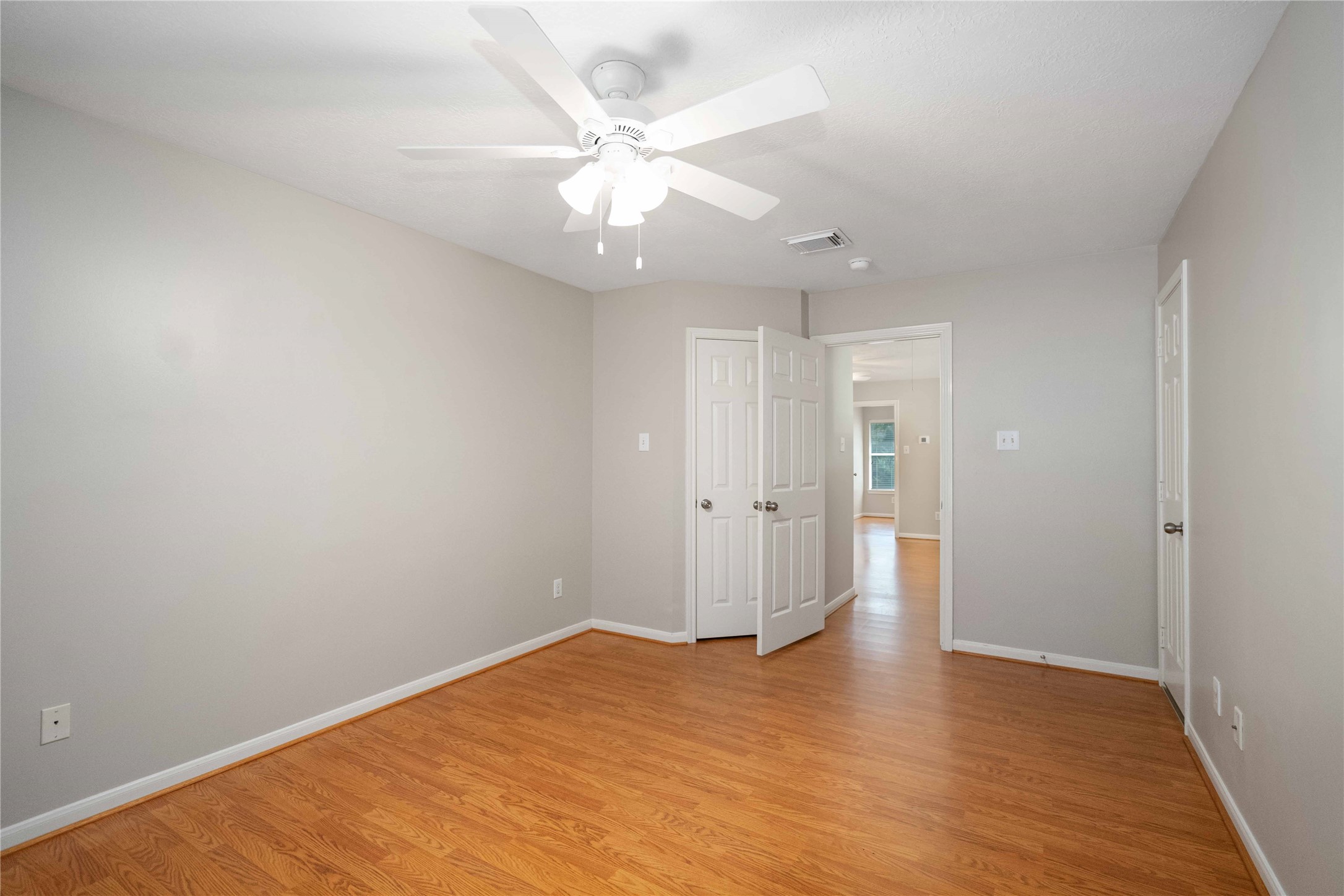 707 Lytton Springs Way Spring, TX 77373 - Photo 22 of 27 wooden floor in an empty room