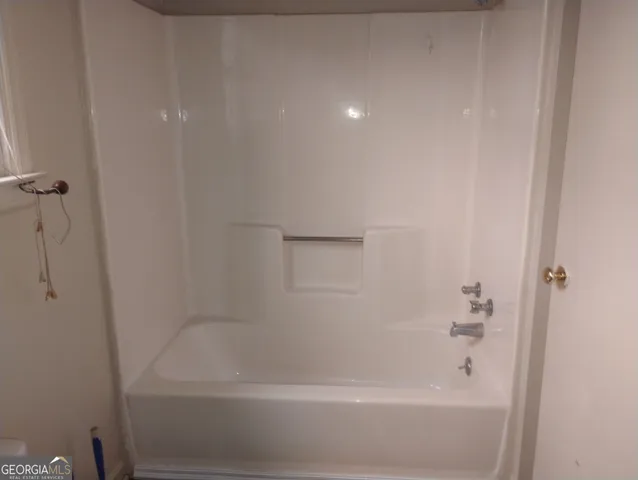 a close view of a bathtub in bathroom