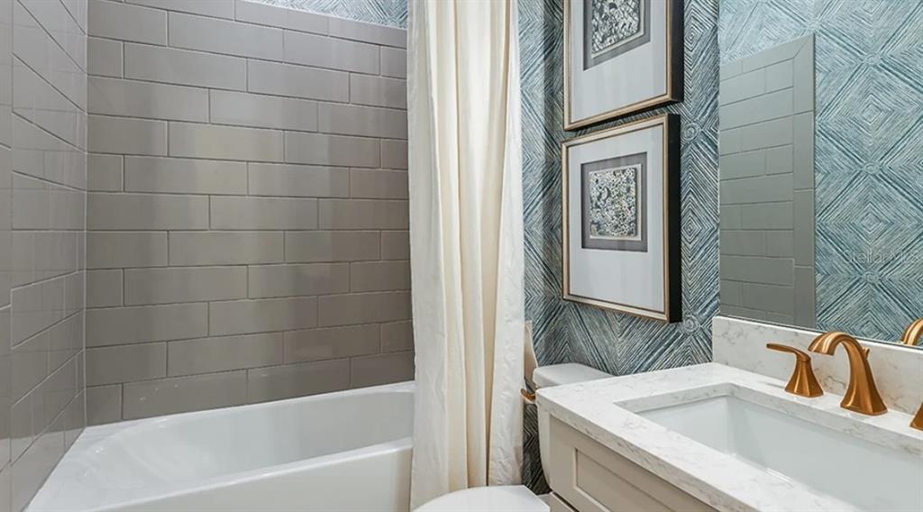 14923 Contenta Loop Bradenton, FL 34211 - Photo 13 of 31 a bathroom with a sink and a bathtub