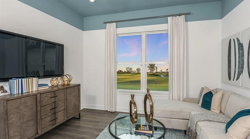 14923 Contenta Loop Bradenton, FL 34211 - Photo 8 of 31 a living room with furniture