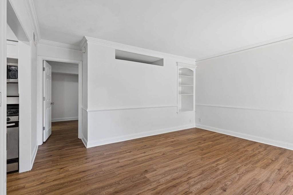 6980 Roswell Road, Unit C13 Atlanta, GA 30328 - Photo 13 of 49 wooden floor in an empty room