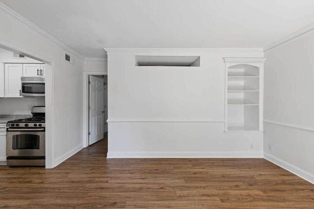 6980 Roswell Road, Unit C13 Atlanta, GA 30328 - Photo 25 of 49 a view of empty room with wooden floor