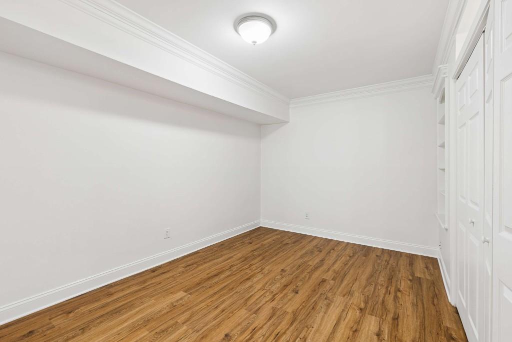 6980 Roswell Road, Unit C13 Atlanta, GA 30328 - Photo 26 of 49 a view of empty room with wooden floor
