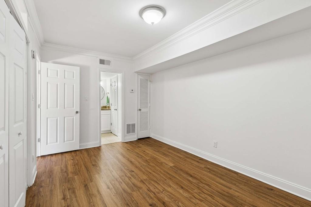 6980 Roswell Road, Unit C13 Atlanta, GA 30328 - Photo 31 of 49 a view of an empty room with wooden floor