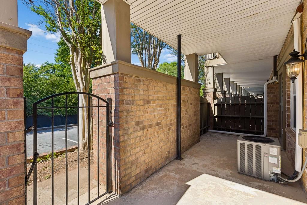 6980 Roswell Road, Unit C13 Atlanta, GA 30328 - Photo 5 of 49 a view of a house with a street