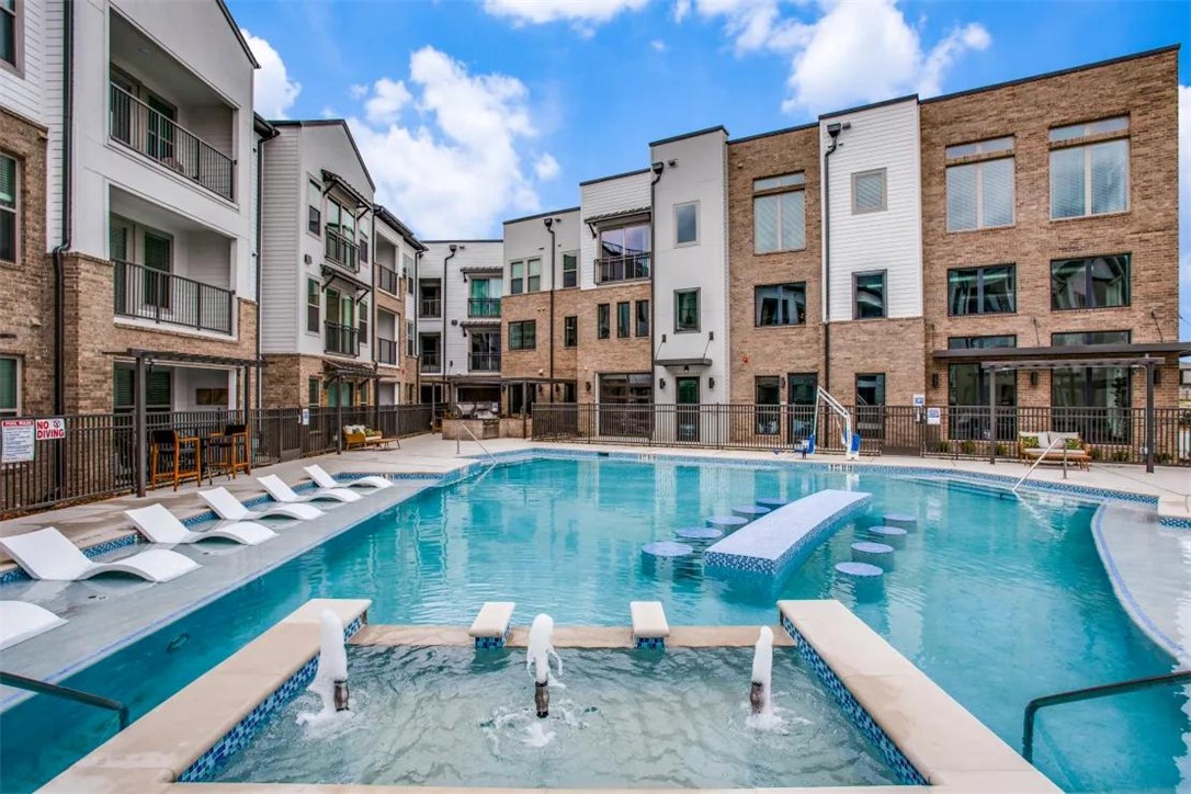 950 Town Lake Drive, Unit 1219 College Station, TX 77845 - Photo 3 of 20 a view of a swimming pool with a patio
