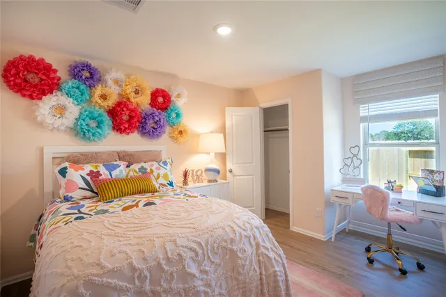 a bedroom with a bed and a window