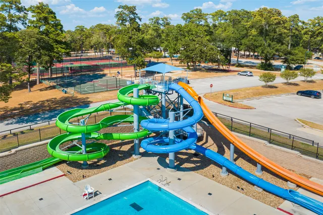 a view of a swimming pool with an outdoor space and seating area