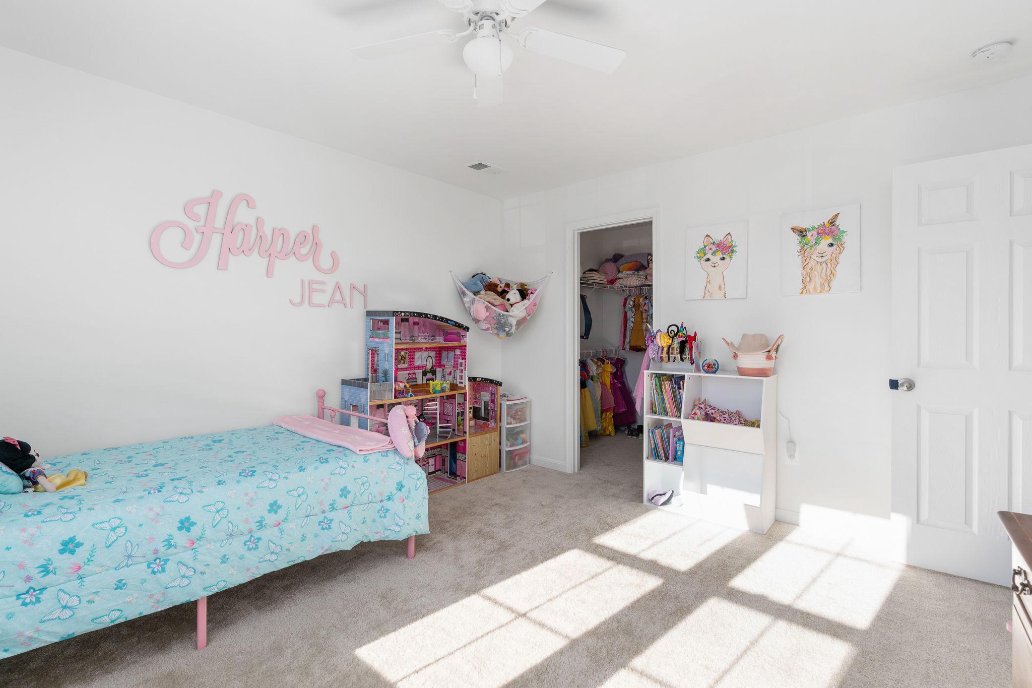 6371 Pointer Lane King George, VA 22485 - Photo 19 of 38 a bedroom with a bed and a chandelier