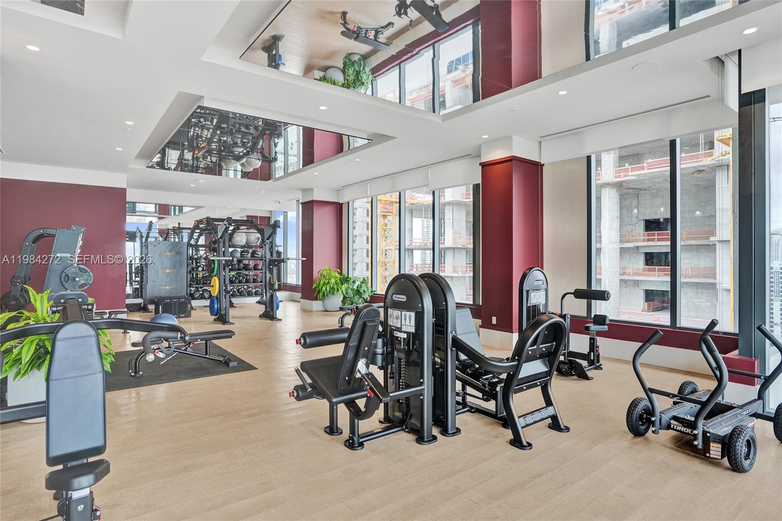 11 Northeast 6th Street, Unit 1403 Miami, FL 33132 - Photo 31 of 44 a view of a room with gym equipment