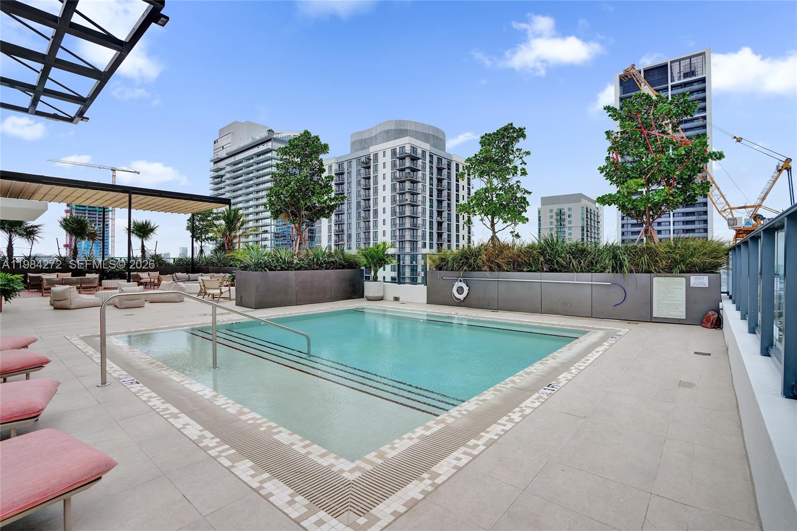 11 Northeast 6th Street, Unit 1403 Miami, FL 33132 - Photo 38 of 44 a view of a patio with a table and chairs