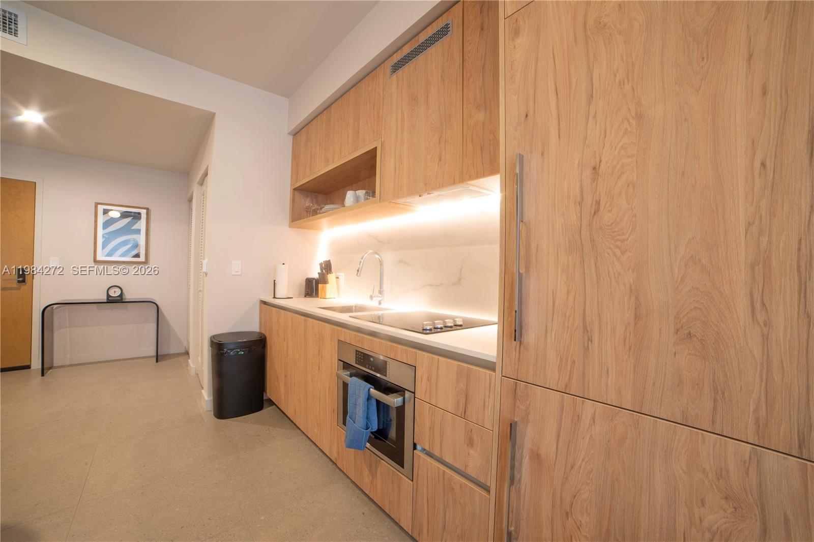 11 Northeast 6th Street, Unit 1403 Miami, FL 33132 - Photo 4 of 44 a large room with a double vanity sink and a window