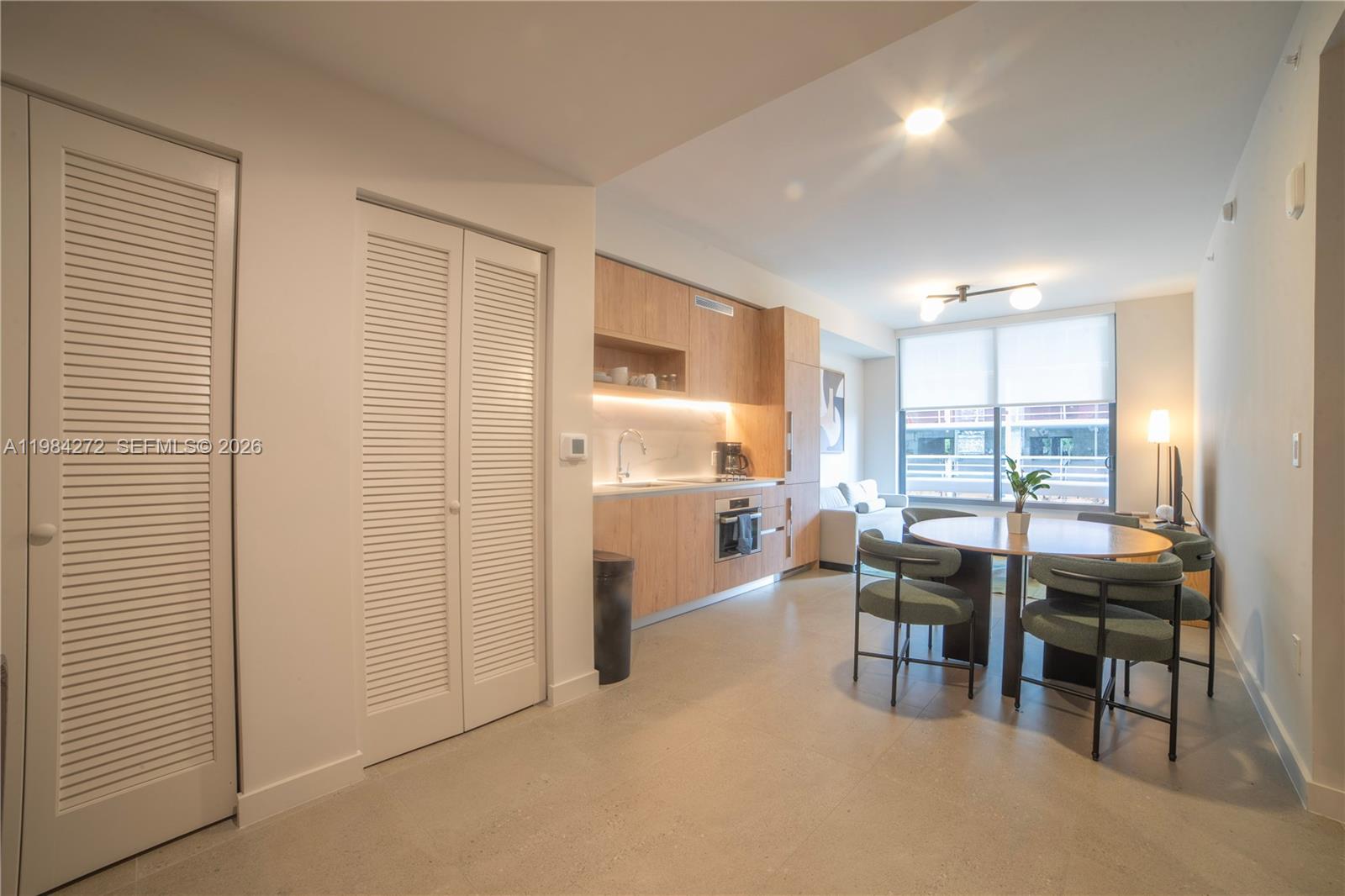 11 Northeast 6th Street, Unit 1403 Miami, FL 33132 - Photo 9 of 44 a room with furniture and a window