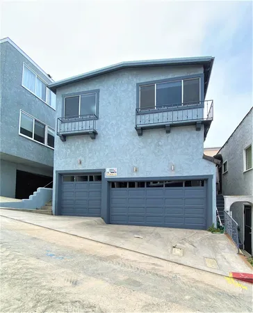 a front view of a house with a garage