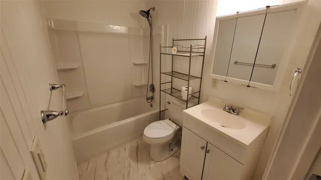 a view of an empty room with a kitchen