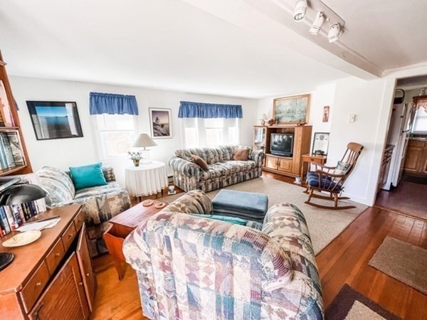 849 State Road, Unit 1 Aquinnah, MA 02535 - Photo 6 of 8 a view of a livingroom with furniture and a flat screen tv