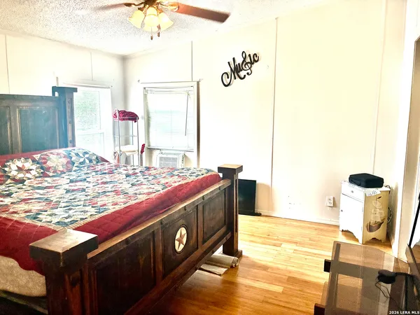 a kitchen with a stove and a dining table