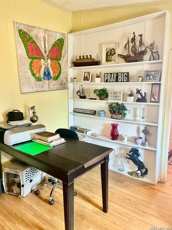 a view of a workspace with furniture