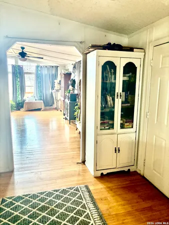 a view of front door and porch with wooden floor