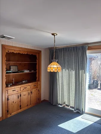 a kitchen with stainless steel appliances a stove and a refrigerator with wooden floor