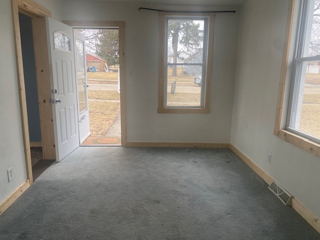 215 West 5th Street Spring Valley, IL 61362 - Photo 2 of 7 an empty room with windows and closet