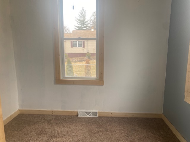 215 West 5th Street Spring Valley, IL 61362 - Photo 5 of 7 an empty room with a window